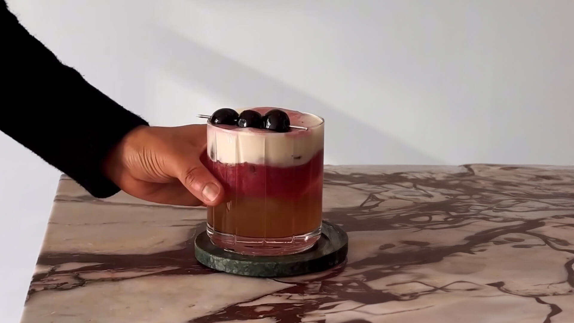 A red wine bourbon sour cocktail.