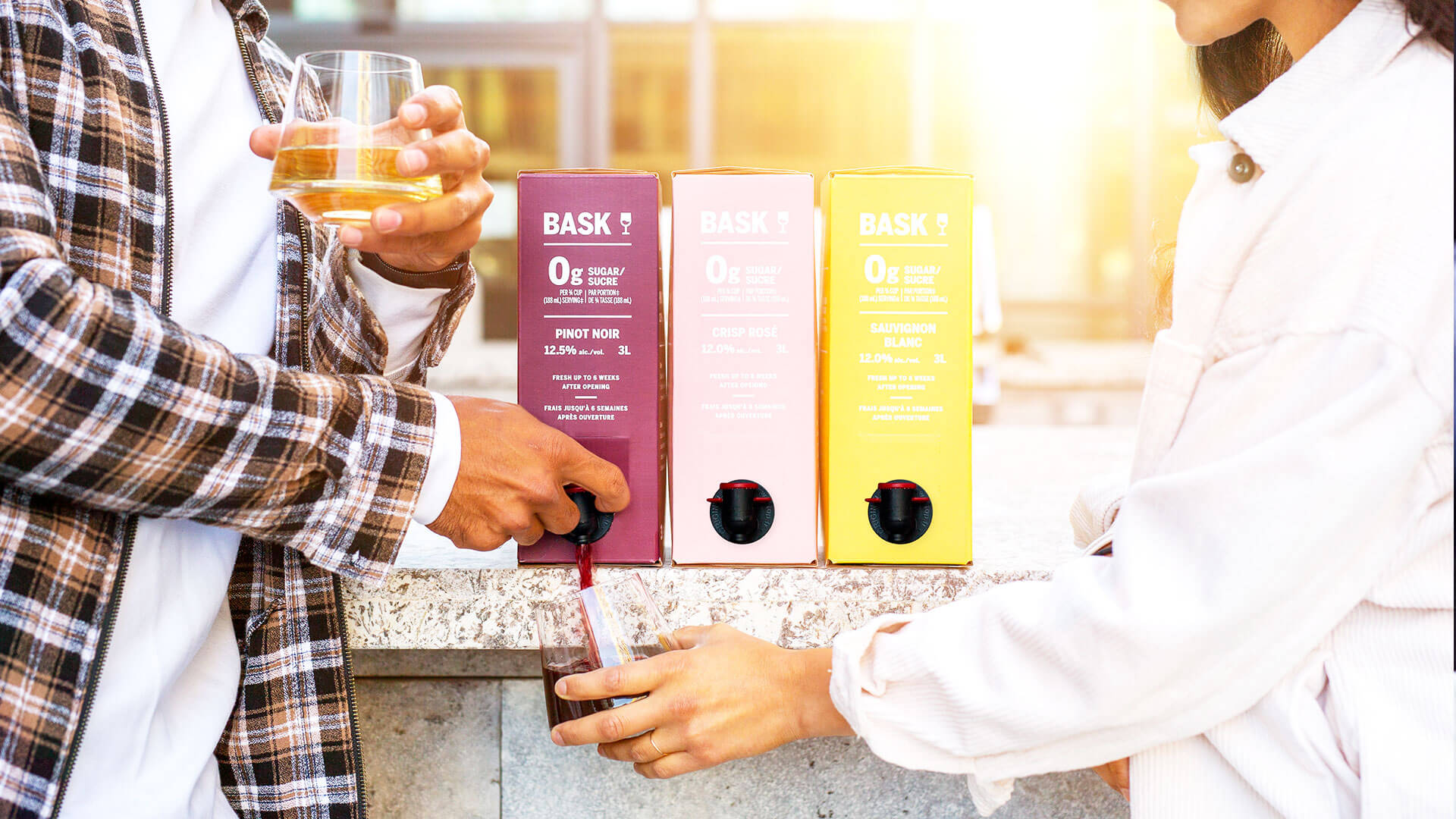 Couple enjoying Bask 3L Box Wines.